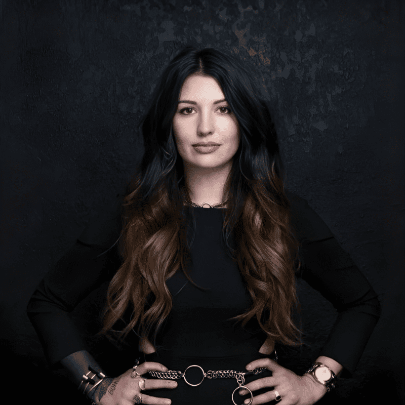 Portrait of Miranda Buzzella, a professional stylist at Educe Salon, showcasing their expertise and style.